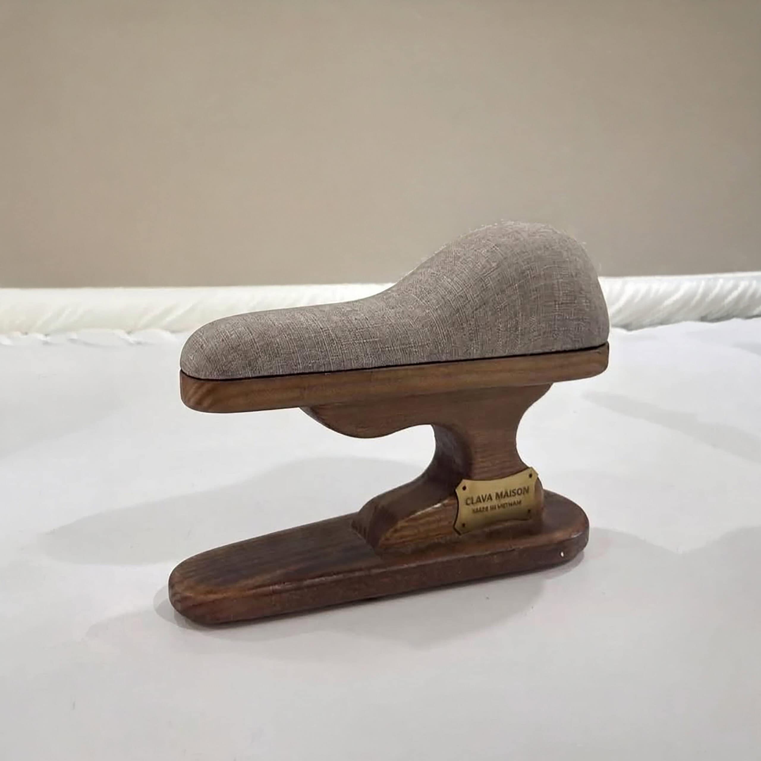 Bust Pressing Ham On Wooden Stan